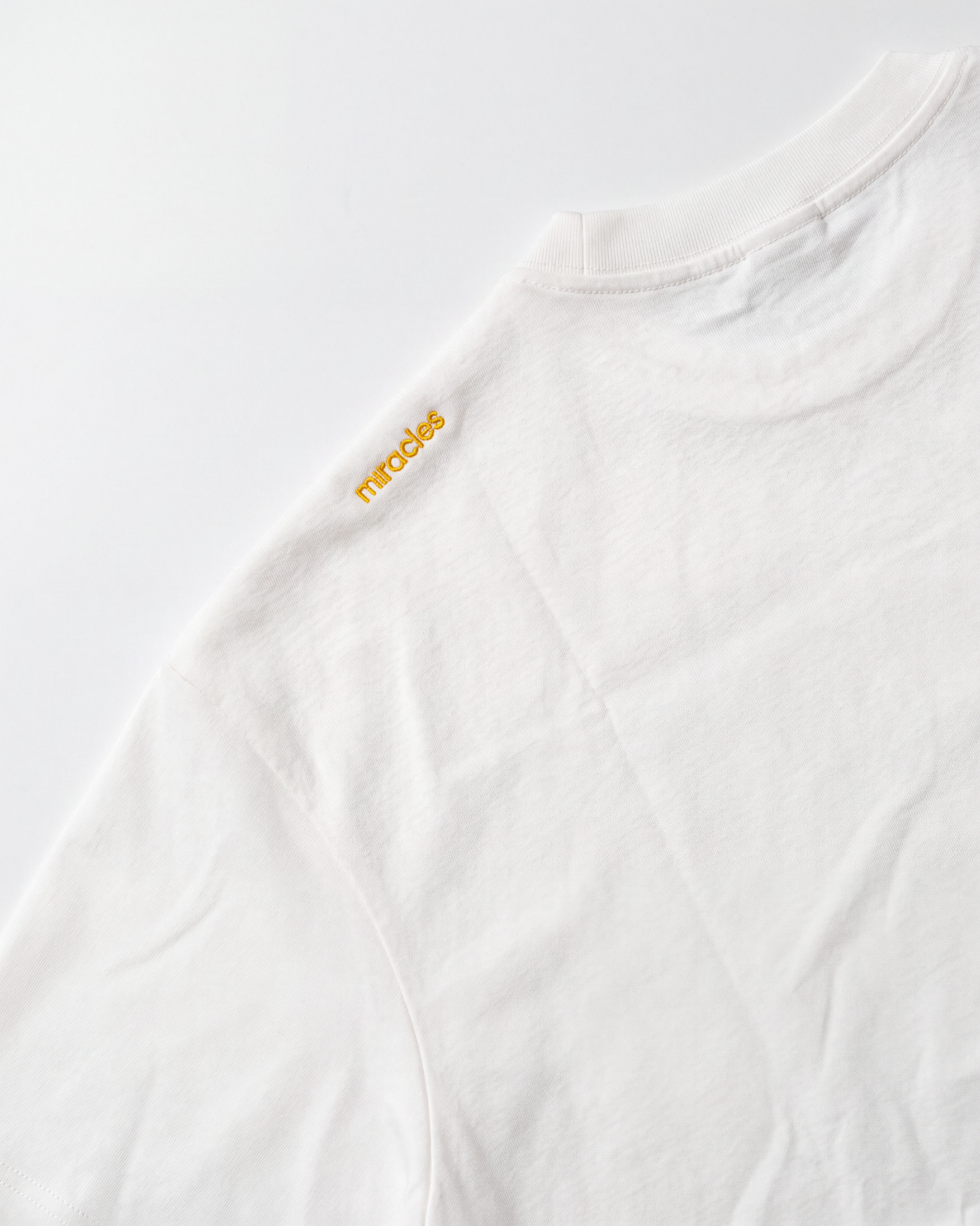 Deemples × Miracles Golf — Oversized Varsity Tee