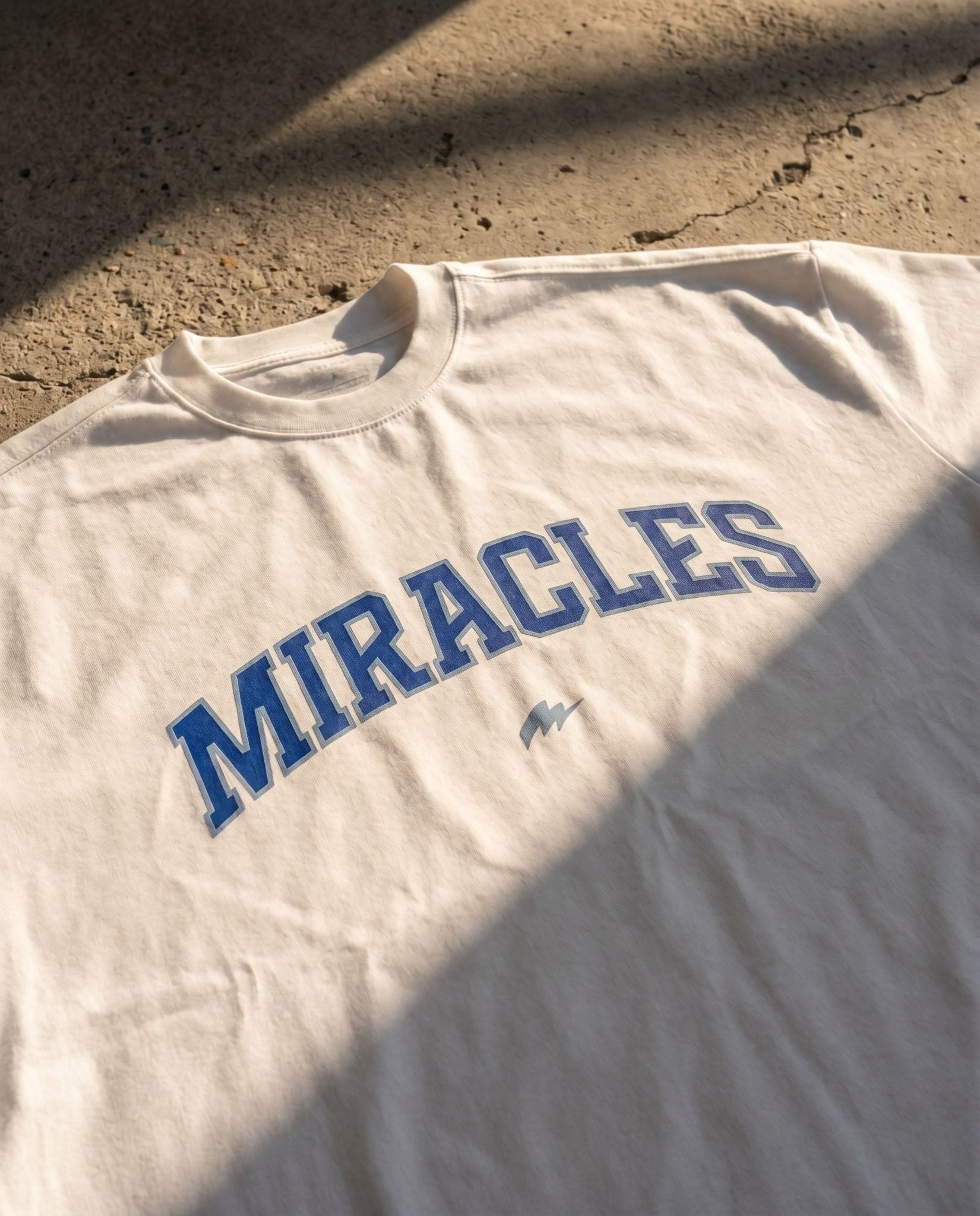 Varsity Oversized T-Shirt (White / Blue) - Miracles Golf